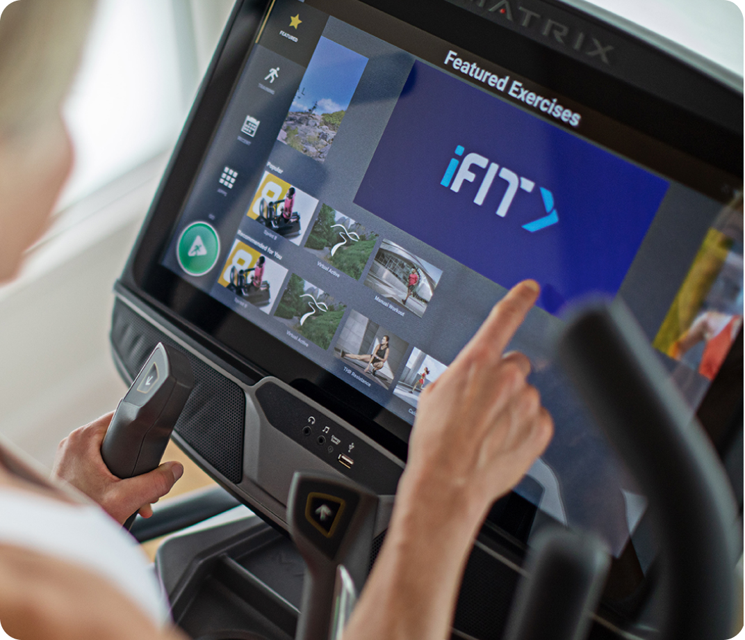 Close-up of a Matrix touchscreen console displaying workout programs.