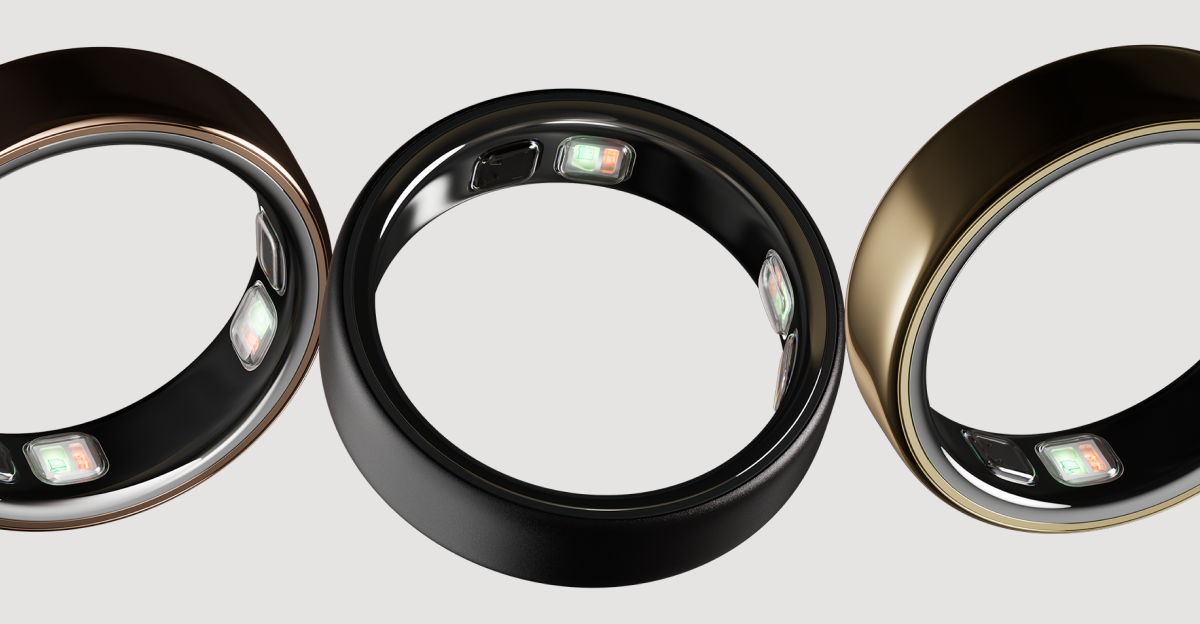 3 Oura Rings shown at an angle against a light gray background — a deep rose ring on the left, a black ring in the center, and a gold ring on the right — each showing the sensor bumps on the inner band.