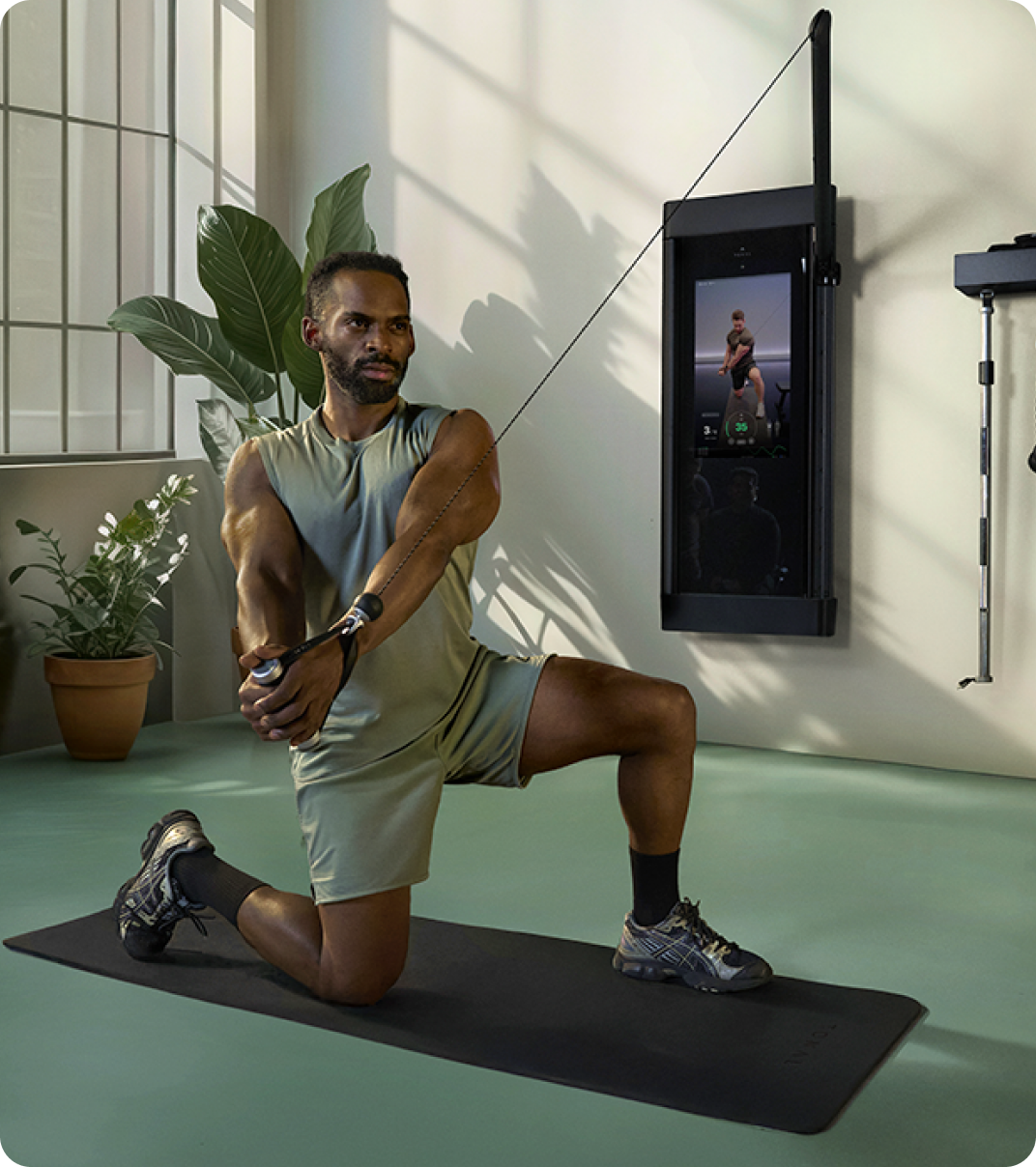 Man using the Tonal 2 Smart Home Gym at home.