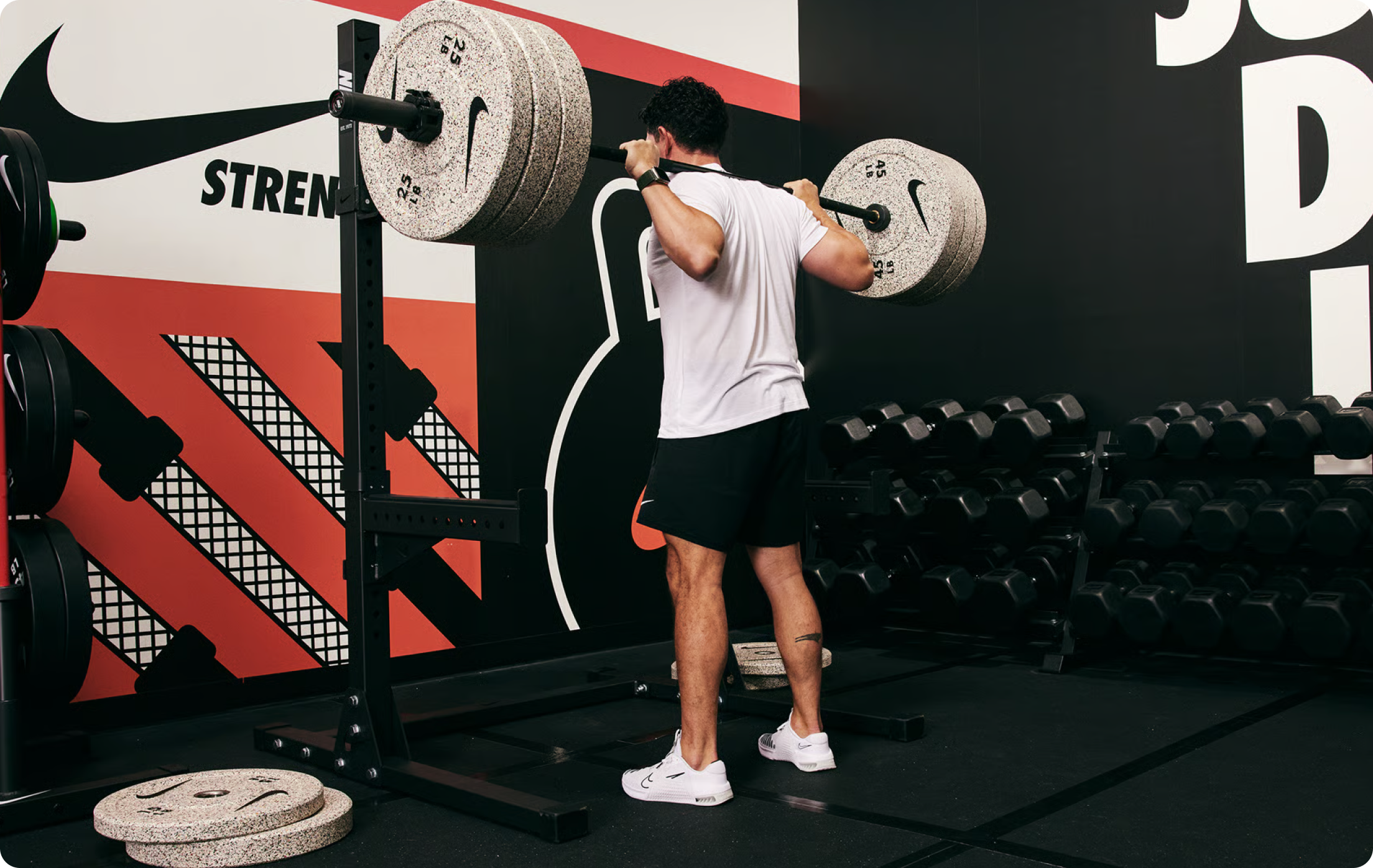 Man doing strength training with Nike equipment.