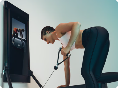 Woman strength training with Tonal 2