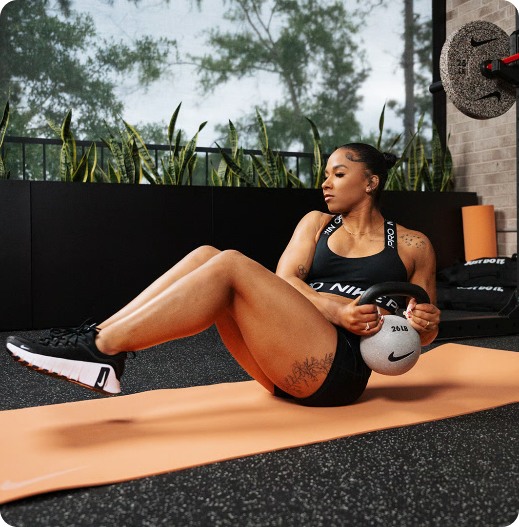 Woman training with Nike Strength equipment