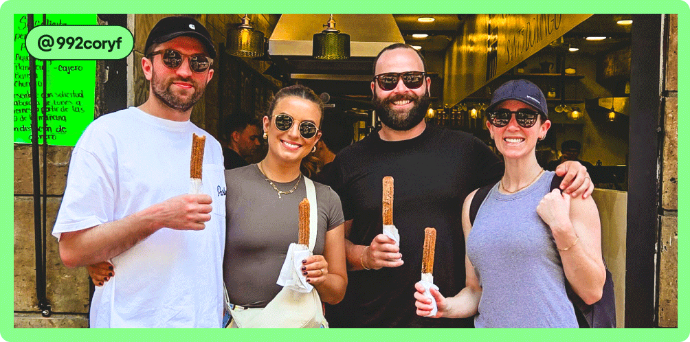 Image Description: Four people standing holding churros wrapped in paper, photo taken by @992coryf